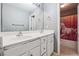 Bathroom boasts a double sink vanity with white cabinets and a view into the shower and toilet room at 3725 Falls Trl, Winston, GA 30187