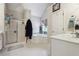 Bright bathroom featuring a glass shower, soaking tub, and a neutral color palette at 3725 Falls Trl, Winston, GA 30187