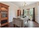 Formal dining room featuring hardwood floors, chandelier, and natural light at 3725 Falls Trl, Winston, GA 30187