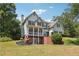 Spacious two-story home with a porch and brick foundation at 3725 Falls Trl, Winston, GA 30187
