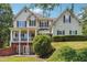 Charming two-story home with a welcoming porch and walkout basement at 3725 Falls Trl, Winston, GA 30187