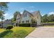 Well-maintained home with manicured lawn and mature landscaping, offering curb appeal and privacy at 3725 Falls Trl, Winston, GA 30187
