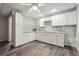Modern kitchen with white cabinets, granite countertops, mosaic backsplash, and stainless steel appliances at 3725 Falls Trl, Winston, GA 30187
