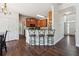 Kitchen with breakfast bar, wood cabinets, and hardwood floors at 3725 Falls Trl, Winston, GA 30187