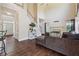 Spacious living room with soaring ceilings, fireplace, and staircase access at 3725 Falls Trl, Winston, GA 30187