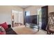 Carpeted living room featuring an entertainment system and modern windows at 3725 Falls Trl, Winston, GA 30187
