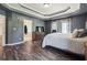 Serene main bedroom with tray ceilings, stylish decor, and ample natural light at 3725 Falls Trl, Winston, GA 30187