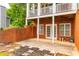 Covered brick patio with access to the basement, offering a private outdoor space and natural light at 3725 Falls Trl, Winston, GA 30187