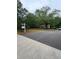 Long driveway leading to a single story home with lush green trees at 4897 Lou Ivy Rd, Peachtree Corners, GA 30096