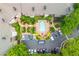 Aerial view of a complex featuring a pool, parking and green spaces at 825 Highland Ne Ln # 1116, Atlanta, GA 30306