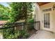 Charming outdoor balcony with wrought iron railing and a door at 825 Highland Ne Ln # 1116, Atlanta, GA 30306