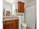 Well-lit bathroom featuring wooden vanity and a neutral tile shower at 825 Highland Ne Ln # 1116, Atlanta, GA 30306
