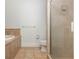 Bathroom featuring a shower, tiled floor and a tub with a tiled wall at 825 Highland Ne Ln # 1116, Atlanta, GA 30306