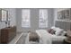Comfortable bedroom with modern decor, two windows, and a dresser at 825 Highland Ne Ln # 1116, Atlanta, GA 30306