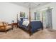Comfortable bedroom with a four-poster bed, neutral paint, and carpeted floor at 825 Highland Ne Ln # 1116, Atlanta, GA 30306