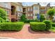 Beautiful brick building entrance with lush green landscaping at 825 Highland Ne Ln # 1116, Atlanta, GA 30306