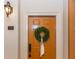 Charming front door with a wreath and address number 1116 at 825 Highland Ne Ln # 1116, Atlanta, GA 30306