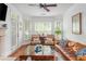 Bright living room featuring hardwood floors, a fireplace, and stylish decor at 825 Highland Ne Ln # 1116, Atlanta, GA 30306