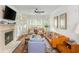 Bright living room with a fireplace, neutral paint, and a wall of windows at 825 Highland Ne Ln # 1116, Atlanta, GA 30306