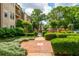 Landscaped walkway leading to a refreshing community pool area at 825 Highland Ne Ln # 1116, Atlanta, GA 30306