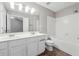 Bright bathroom with double sink vanity, ceramic tile flooring, and tub and shower combination at 9165 Nesbit Ferry Rd # 9, Alpharetta, GA 30022