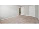 Bedroom with light gray walls, carpeted floors, and white doors and trim at 9165 Nesbit Ferry Rd # 9, Alpharetta, GA 30022