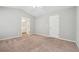 Neutral bedroom featuring carpeted floor, light gray walls, and white trim at 9165 Nesbit Ferry Rd # 9, Alpharetta, GA 30022