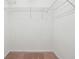 Walk-in closet with a carpet and basic wire shelving at 9165 Nesbit Ferry Rd # 9, Alpharetta, GA 30022