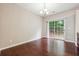 Cozy dining area with hardwood floors and sliding glass doors leading to the outdoor area at 9165 Nesbit Ferry Rd # 9, Alpharetta, GA 30022