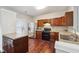 Well-equipped kitchen with hardwood floors, stainless steel appliances, and dark wood cabinets at 9165 Nesbit Ferry Rd # 9, Alpharetta, GA 30022