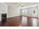 Bright living room featuring hardwood floors, a fireplace, and a doorway to the exterior at 9165 Nesbit Ferry Rd # 9, Alpharetta, GA 30022