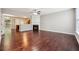 Spacious living room with hardwood floors, fireplace, and ample natural light from a large window at 9165 Nesbit Ferry Rd # 9, Alpharetta, GA 30022