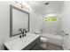 Bathroom featuring a single sink vanity, marble countertop, and shower-tub combination at 110 Beaver Pointe, Villa Rica, GA 30180