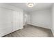 Bright bedroom featuring a modern light fixture and a spacious closet with natural light at 110 Beaver Pointe, Villa Rica, GA 30180