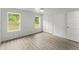 Inviting bedroom with bright white walls and wood-look floors, illuminated by natural light at 110 Beaver Pointe, Villa Rica, GA 30180