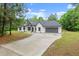 Charming craftsman-style home with white siding, black trim, and a long driveway at 110 Beaver Pointe, Villa Rica, GA 30180