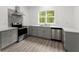 Modern kitchen featuring stainless steel appliances, light grey cabinetry and a window with natural light at 110 Beaver Pointe, Villa Rica, GA 30180