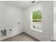 Practical laundry room featuring ample natural light and modern fixtures for added convenience at 110 Beaver Pointe, Villa Rica, GA 30180