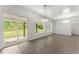 Bright and airy living room with a sliding door leading to an outdoor patio with scenic backyard views at 110 Beaver Pointe, Villa Rica, GA 30180