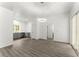 An open living space featuring modern flooring and grey cabinets in the adjacent kitchen at 110 Beaver Pointe, Villa Rica, GA 30180