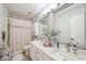Bright bathroom features double sinks, framed mirrors and decorative accents at 19 Margrit Ct, Stockbridge, GA 30281