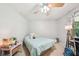 Comfortable bedroom offers neutral walls, a ceiling fan, and natural light at 19 Margrit Ct, Stockbridge, GA 30281
