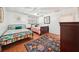Charming bedroom featuring two beds, vibrant rug and cozy decor at 19 Margrit Ct, Stockbridge, GA 30281