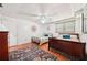 Inviting bedroom offering two beds, a colorful rug, and ample natural light at 19 Margrit Ct, Stockbridge, GA 30281