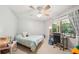 Comfortable bedroom offers neutral walls, a ceiling fan, and natural light at 19 Margrit Ct, Stockbridge, GA 30281