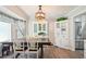 Cozy dining area with modern lighting, hardwood floors, and a large window perfect for Gathering meals at 19 Margrit Ct, Stockbridge, GA 30281