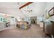 Inviting living room with vaulted ceilings, stone fireplace, and seamless access to the dining area at 19 Margrit Ct, Stockbridge, GA 30281
