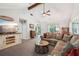 Inviting living room with vaulted ceilings, a cozy fireplace, and stylish decor creating a warm atmosphere at 19 Margrit Ct, Stockbridge, GA 30281
