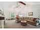 Comfortable living room featuring a vaulted ceiling and a cozy sectional sofa at 19 Margrit Ct, Stockbridge, GA 30281