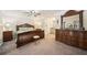 Comfortable main bedroom boasts generous space, neutral tones, and stylish decor at 19 Margrit Ct, Stockbridge, GA 30281
